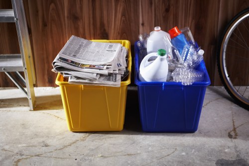 Collection crew placing sealed bags into waste vehicle