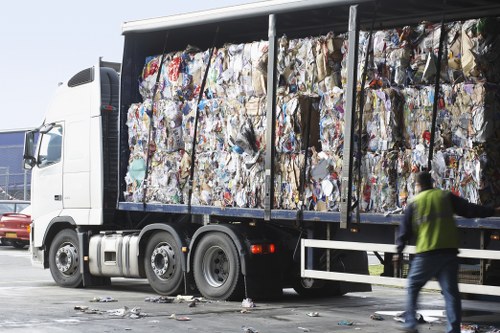 Workers sorting recyclables at a local transfer station in Harlesden area